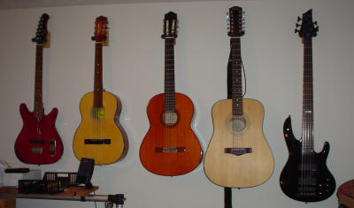 I need MORE guitars! There's still room on the wall!